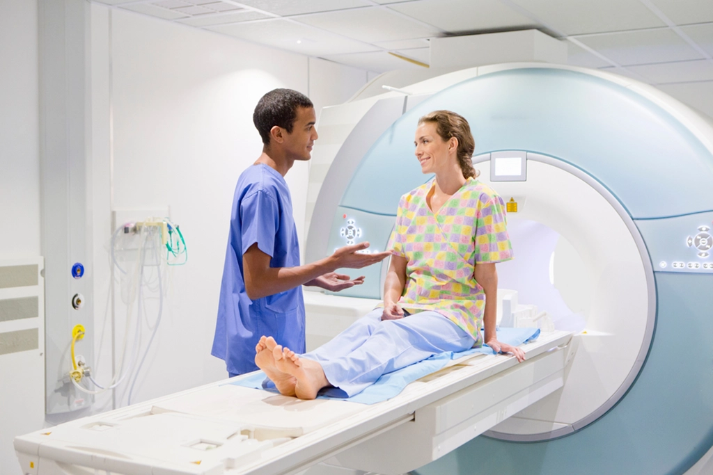 MRI Technologist Consulting A Female Patient Before Her MRI Scan