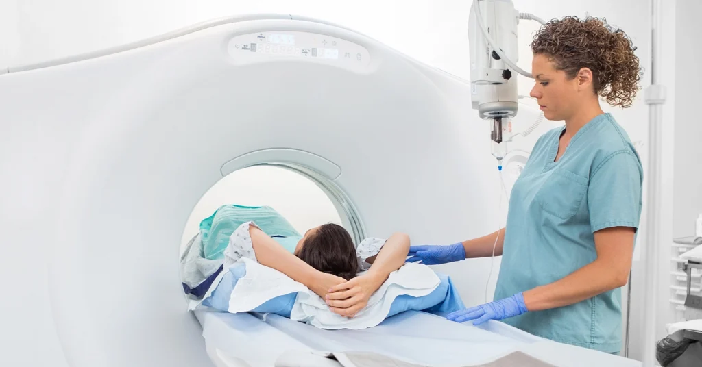 Female Technologist Guides Female Patient During A CT Scan