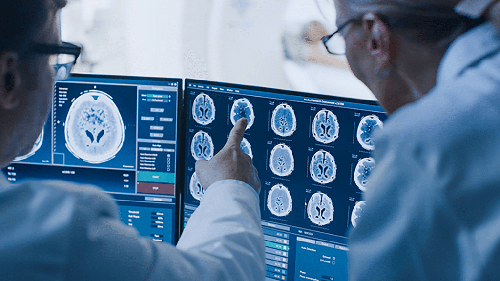 Experienced Technologists Viewing Results Of Brain Scan