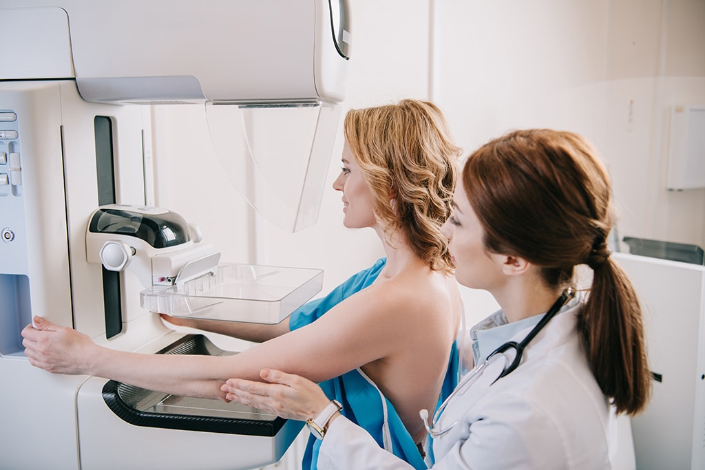 Mammography Technologist Helping Patient During Her 3D Screening Mammogram