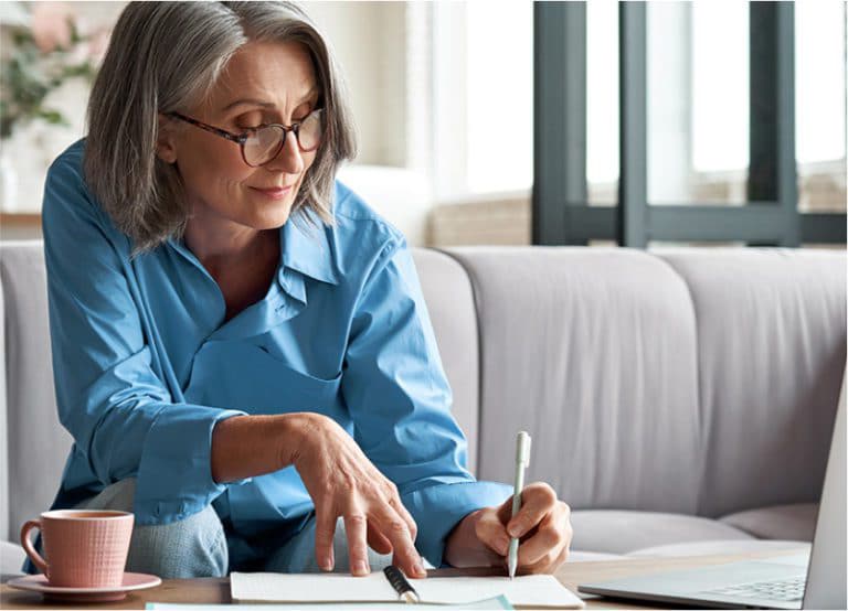 Older Woman Going Over Her To Do List